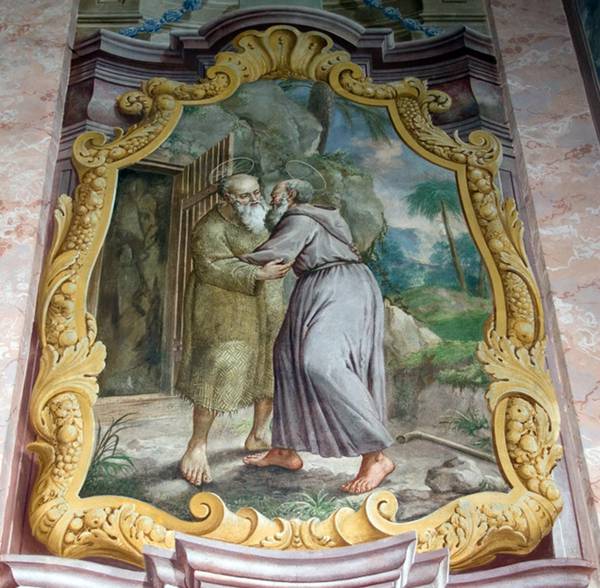 Der hl. Antonius besucht und begrüßt den hl. Paulus in dessen Einsiedelei in der Wüste. Wandfresko von Johann Baptist Scheidt in der Wallfahrts- und ehemaligen Klosterkirche Maria Trost bei Graz, um 1753.
